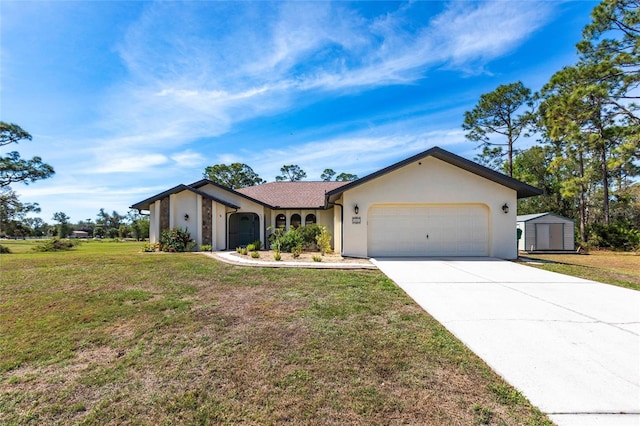 view of front of property with a storage unit, stucco siding, an attached garage, a front yard, and driveway