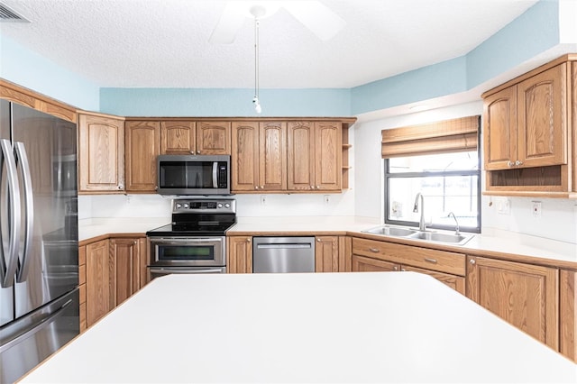 kitchen with stainless steel appliances, a sink, visible vents, light countertops, and open shelves