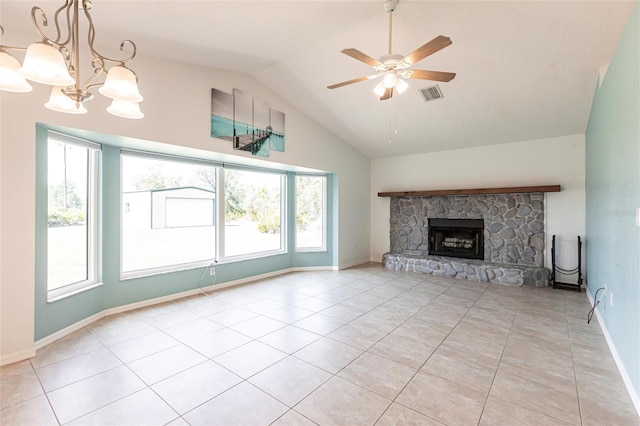 unfurnished living room featuring visible vents, ceiling fan, vaulted ceiling, a fireplace, and light tile patterned flooring