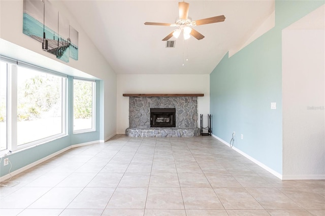 unfurnished living room featuring lofted ceiling, visible vents, light tile patterned flooring, ceiling fan, and baseboards