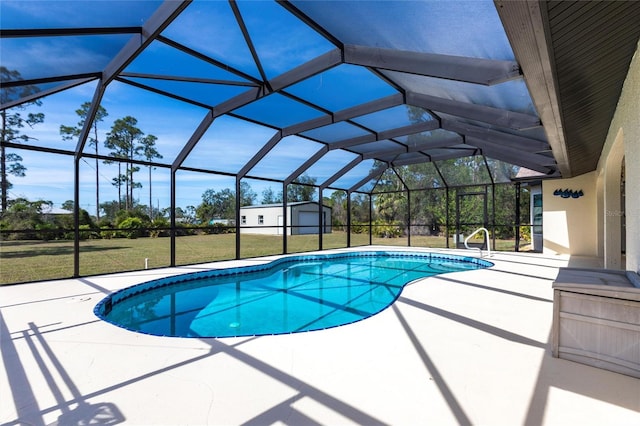 pool featuring a storage shed, glass enclosure, an outbuilding, a yard, and a patio area