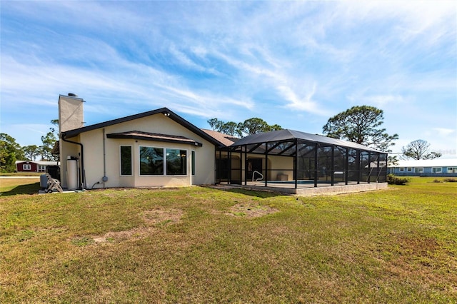 back of house featuring glass enclosure, an outdoor pool, a yard, stucco siding, and a chimney