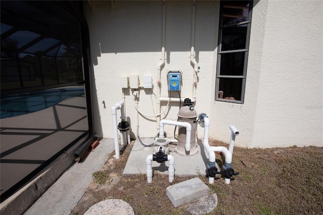 exterior details with pump and stucco siding