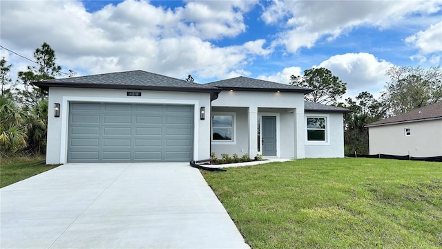 prairie-style house with an attached garage, stucco siding, concrete driveway, and a front yard