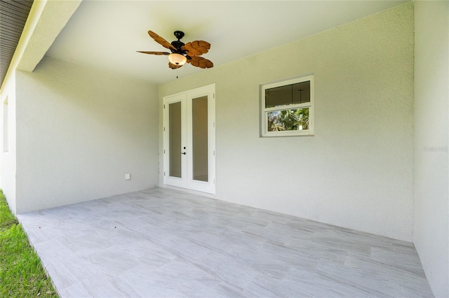 view of patio / terrace featuring a ceiling fan and french doors