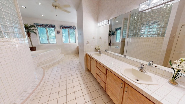 full bathroom featuring double vanity, tile walls, a sink, and tile patterned floors