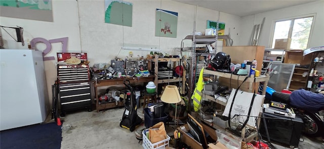 misc room with concrete flooring and a workshop area