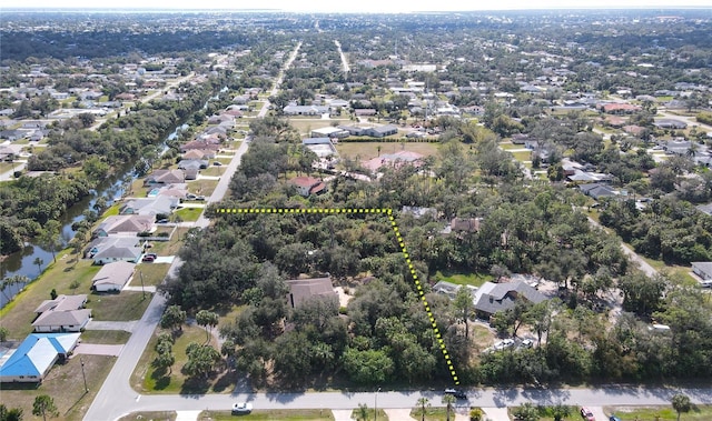 birds eye view of property with a residential view