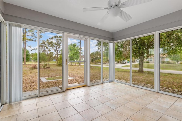 unfurnished sunroom featuring plenty of natural light and ceiling fan