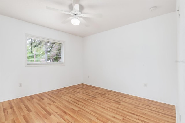 unfurnished room with ceiling fan and light wood-style floors