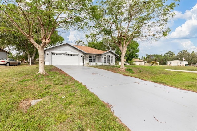 ranch-style house with a garage, concrete driveway, a front yard, and stucco siding