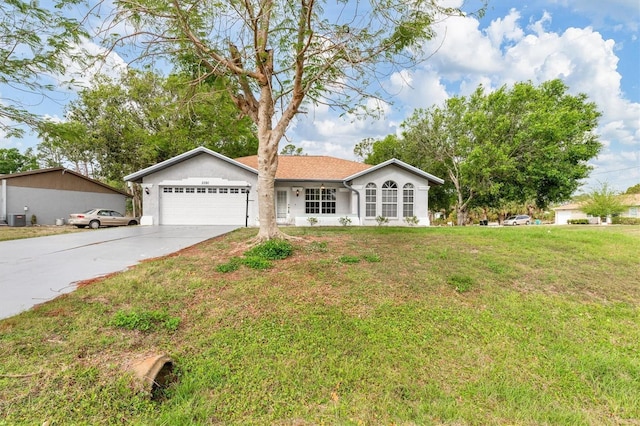 ranch-style house featuring a front yard, an attached garage, and driveway