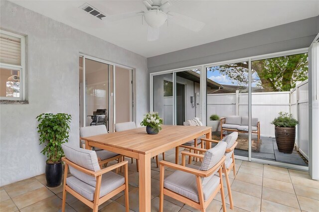 exterior space featuring visible vents and ceiling fan