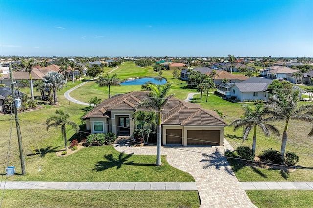 drone / aerial view with a residential view and a water view