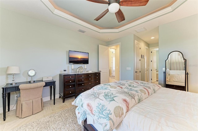 bedroom featuring ceiling fan, visible vents, baseboards, and a raised ceiling