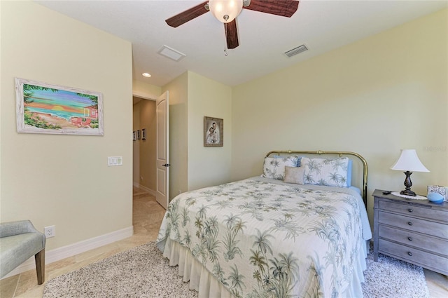 bedroom with ceiling fan, visible vents, and baseboards