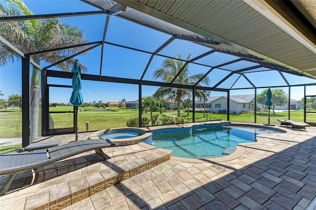 view of pool featuring a lanai, a patio area, a pool with connected hot tub, and a lawn