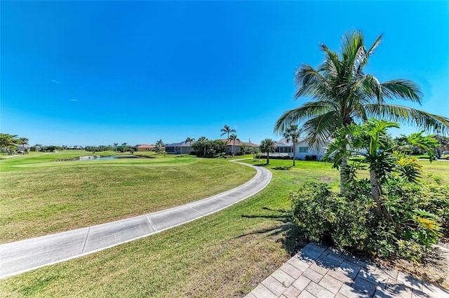 view of home's community featuring a lawn