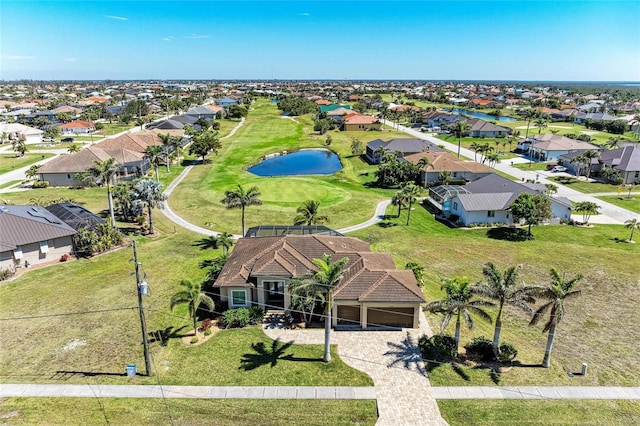 aerial view featuring a residential view, view of golf course, and a water view