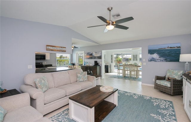 129 Barre Dr NW, Port Charlotte, FL 33952 - living room featuring light tile patterned floors, lofted ceiling, visible vents, a ceiling fan, and baseboards