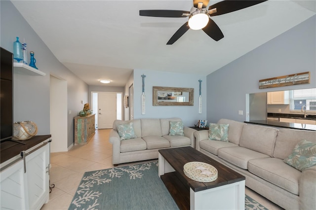 129 Barre Dr NW, Port Charlotte, FL 33952 - living area with light tile patterned flooring and vaulted ceiling