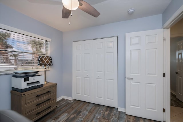 129 Barre Dr NW, Port Charlotte, FL 33952 - bedroom featuring a ceiling fan, a closet, dark wood finished floors, and baseboards