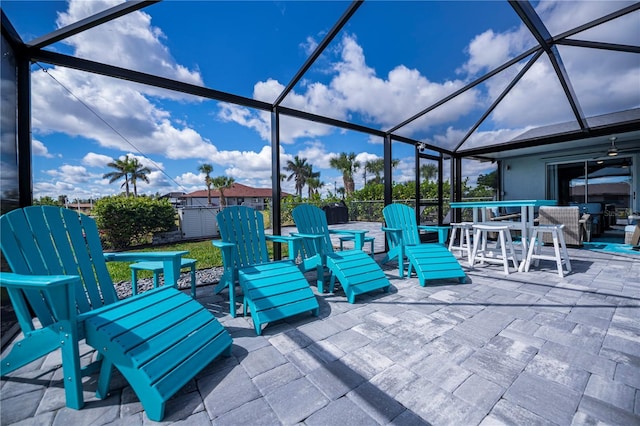 129 Barre Dr NW, Port Charlotte, FL 33952 - view of patio with glass enclosure, a shed, outdoor dining area, and an outdoor structure