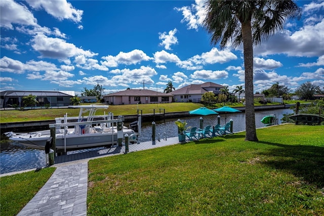 129 Barre Dr NW, Port Charlotte, FL 33952 - dock area featuring a water view, boat lift, a residential view, and a lawn
