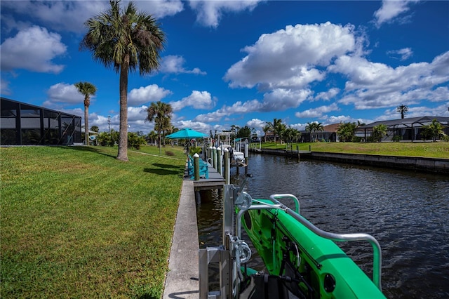 129 Barre Dr NW, Port Charlotte, FL 33952 - dock area with a water view, a lawn, and boat lift