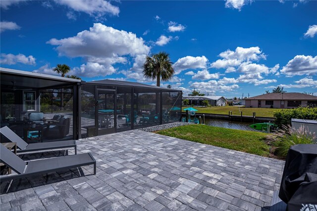 129 Barre Dr NW, Port Charlotte, FL 33952 - view of patio featuring a lanai, a water view, and a swimming pool