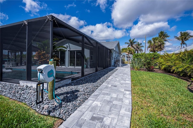 129 Barre Dr NW, Port Charlotte, FL 33952 - view of community featuring a pool, a yard, a patio area, and a gate