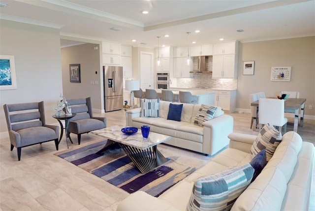 living room featuring baseboards, a raised ceiling, crown molding, and recessed lighting