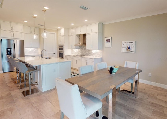 dining room featuring recessed lighting, baseboards, visible vents, and ornamental molding