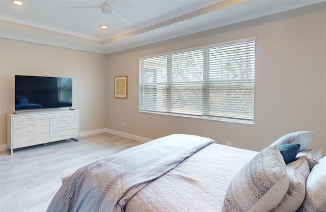 bedroom featuring ceiling fan, baseboards, a tray ceiling, and recessed lighting