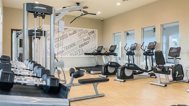 exercise room featuring plenty of natural light, visible vents, wood finished floors, and recessed lighting