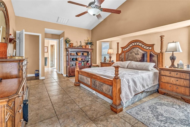 tiled bedroom with lofted ceiling, baseboards, visible vents, and a ceiling fan