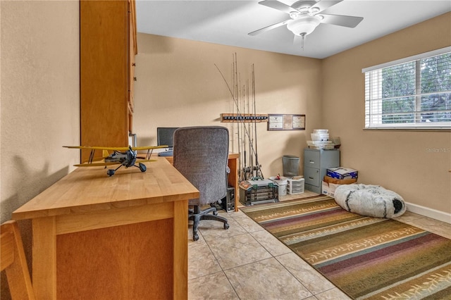 office area featuring light tile patterned floors and ceiling fan