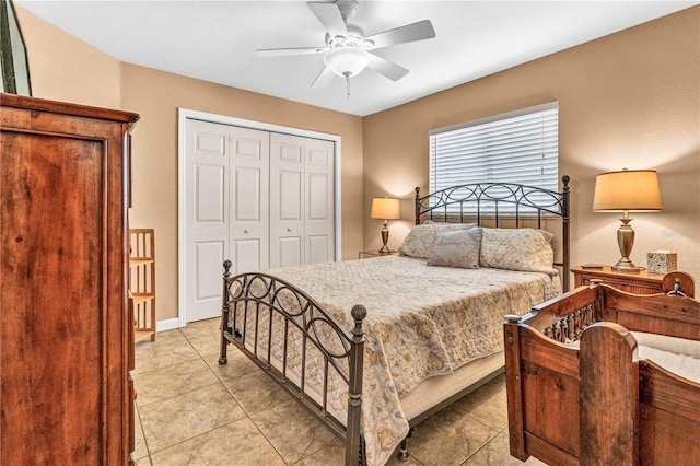 bedroom with light tile patterned floors, a ceiling fan, and a closet