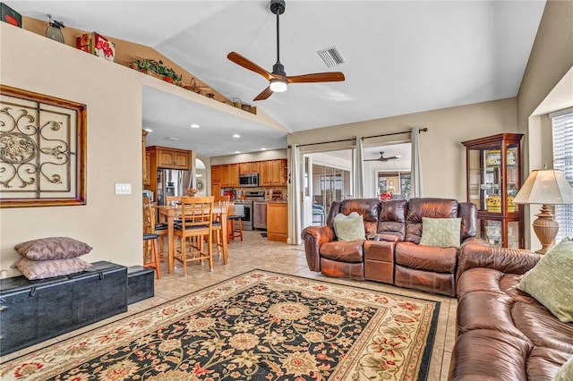 living area featuring lofted ceiling, light tile patterned flooring, recessed lighting, visible vents, and a ceiling fan