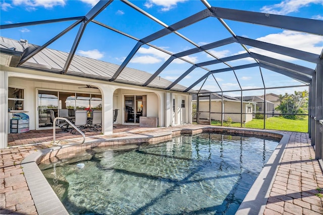 pool featuring a lanai, ceiling fan, and a patio