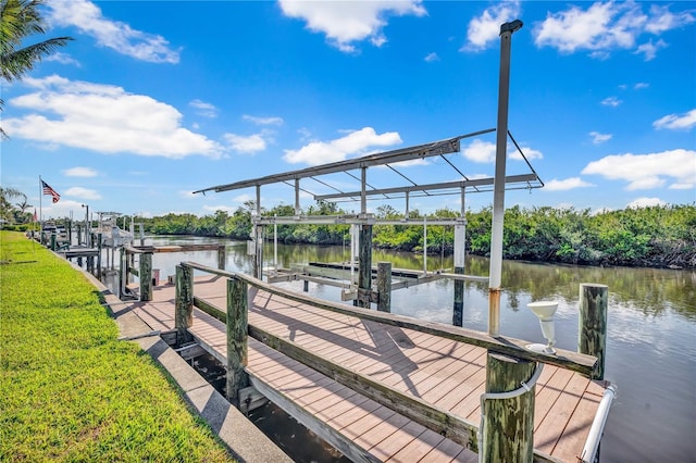 view of dock with a water view and boat lift