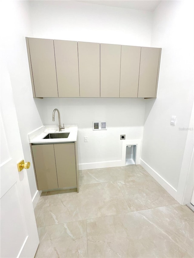 laundry area featuring cabinet space, baseboards, a sink, hookup for a washing machine, and electric dryer hookup