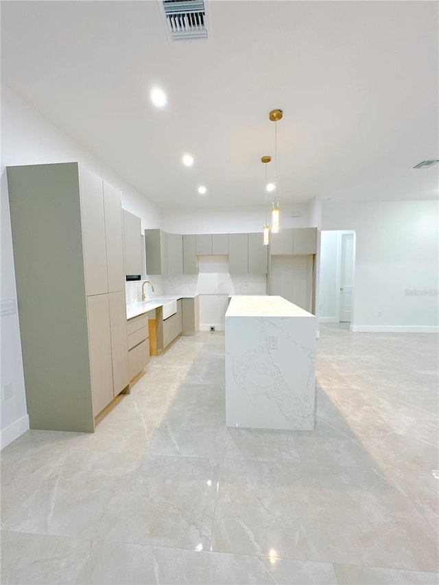 kitchen with modern cabinets, visible vents, gray cabinets, and decorative light fixtures