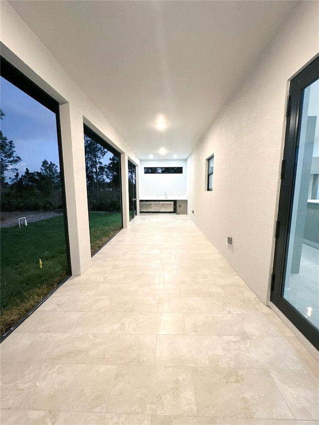 view of patio terrace at dusk