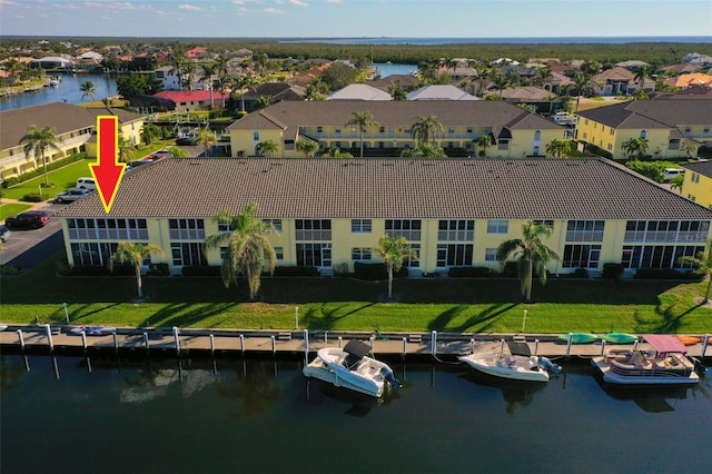 aerial view featuring a water view and a residential view