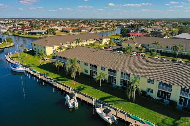 bird's eye view with a water view and a residential view