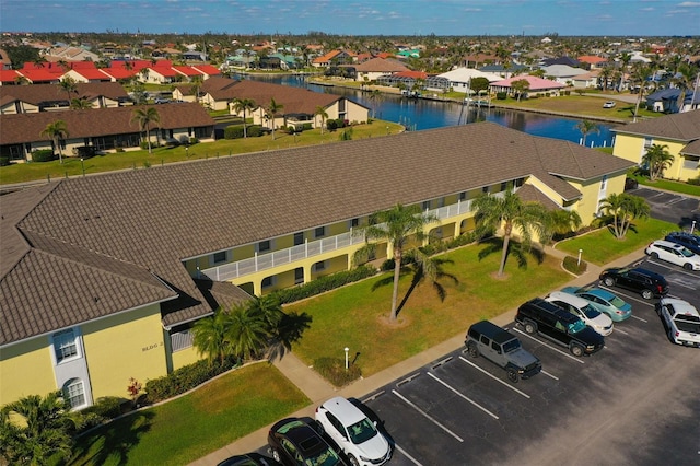 aerial view with a water view and a residential view