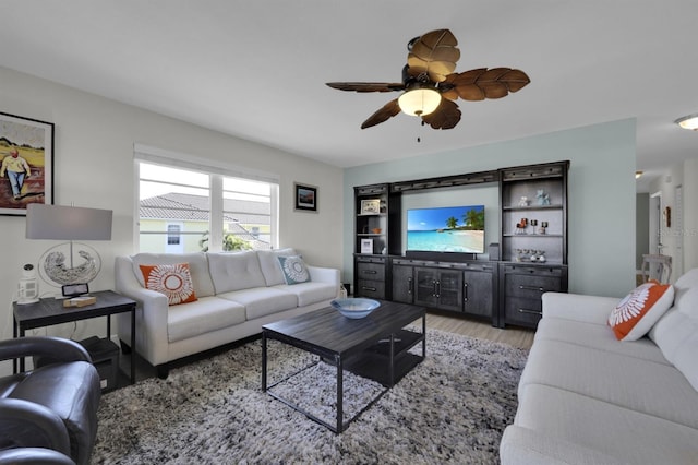 living room featuring light wood-style floors and ceiling fan