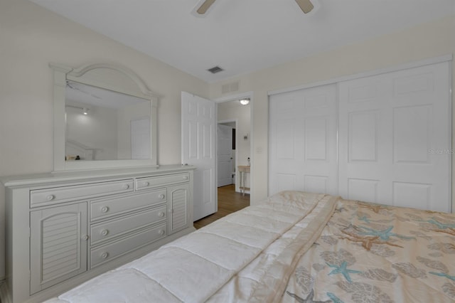 bedroom with a closet, visible vents, and a ceiling fan