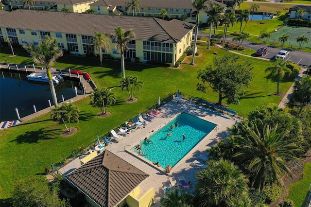 birds eye view of property featuring a water view and a residential view